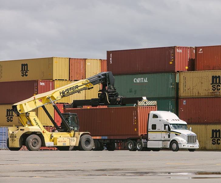 Sunbury truck moving a shipping container